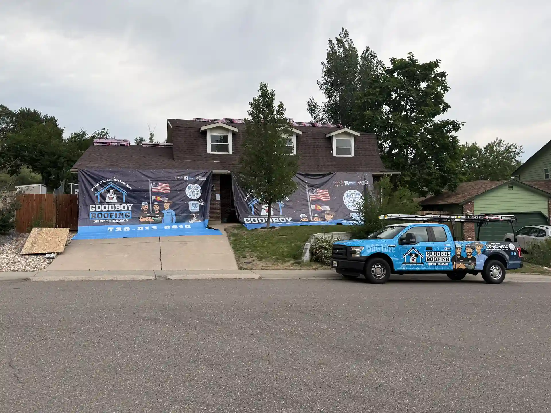 GoodBoy Roofing truck and home protection system onsite