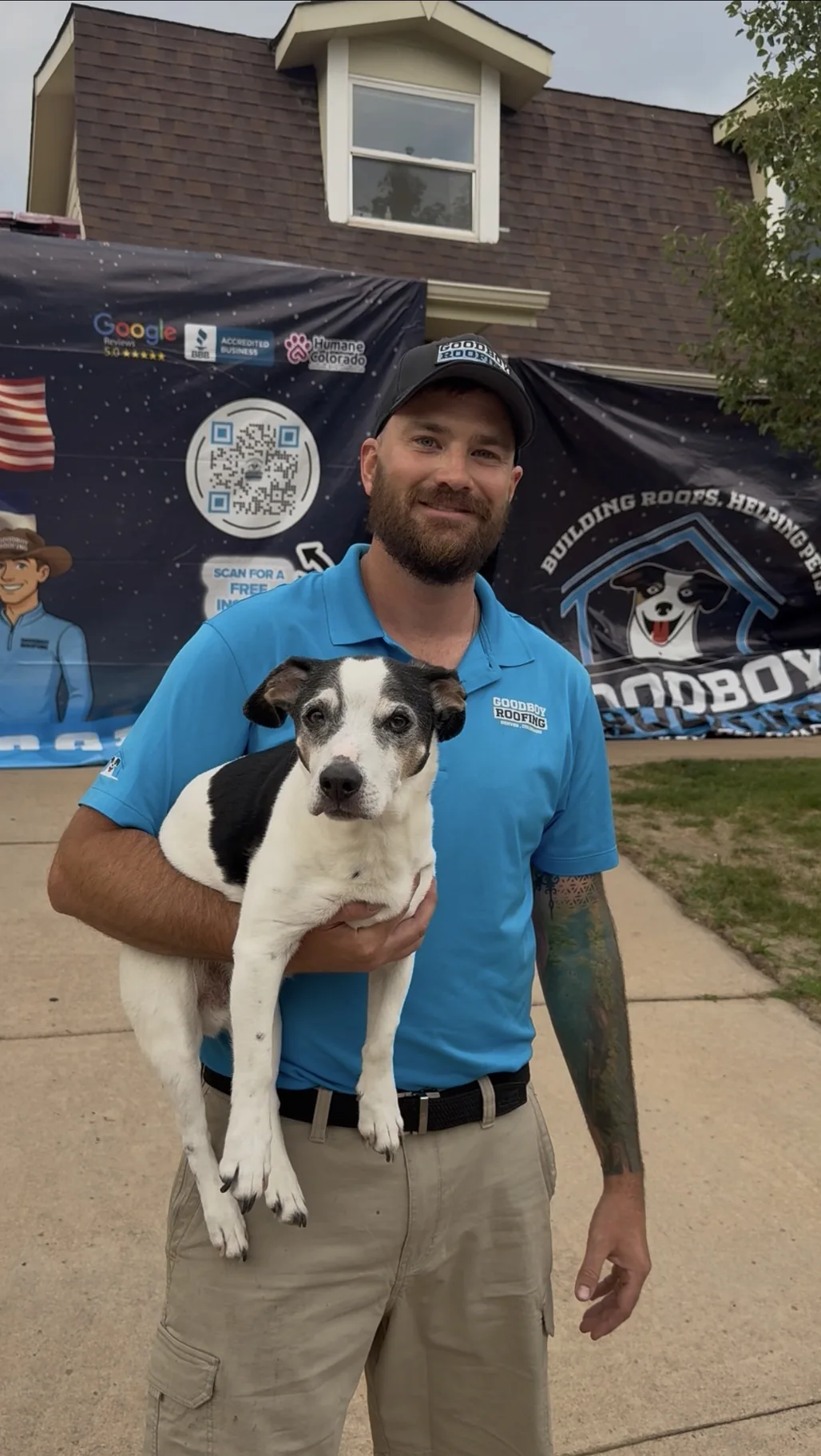 GoodBoy Roofing founder holding a dog